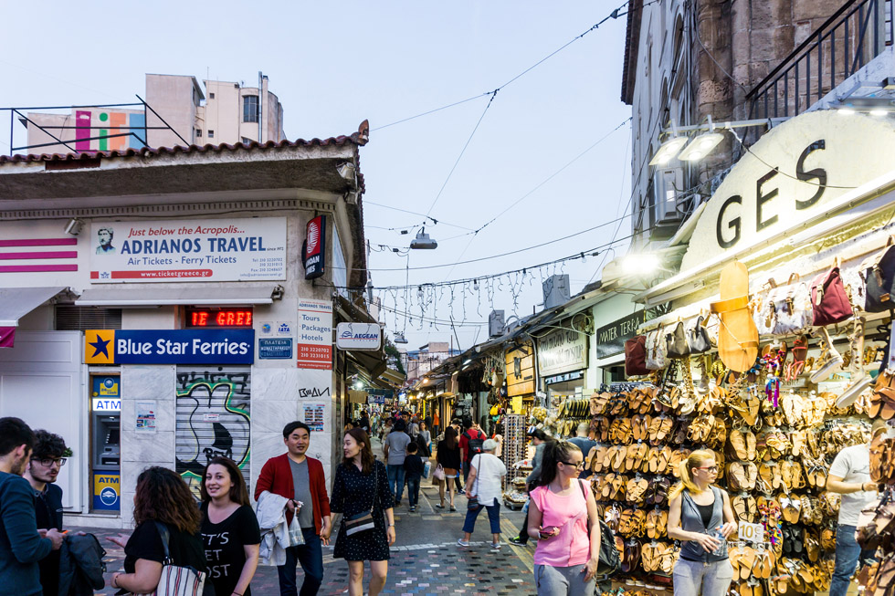 Tourist shopping in Greece by ferry ticket office