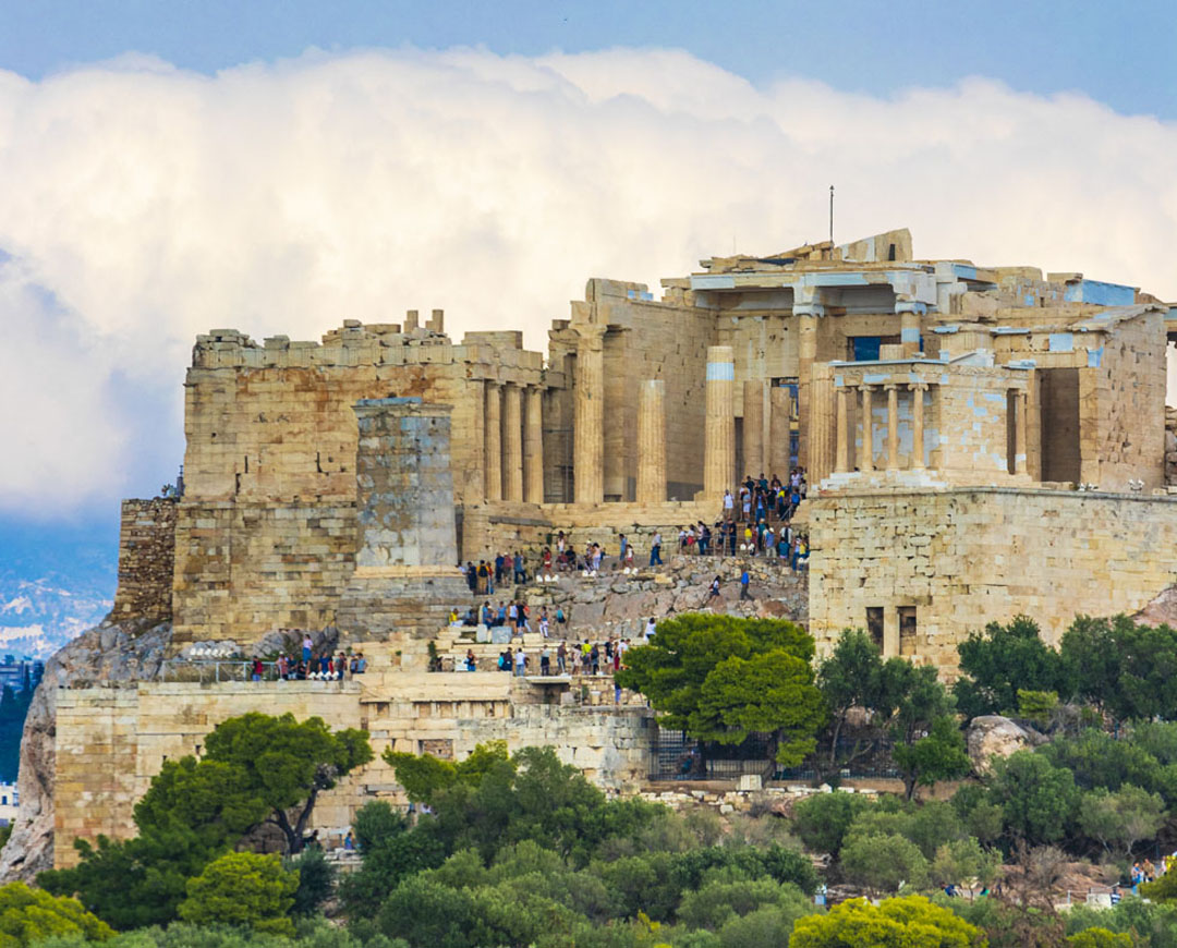 Acropolis under white clouds in Athens Greece