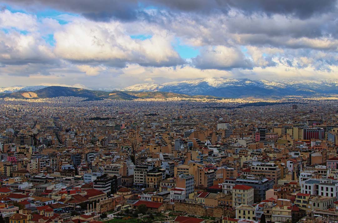 Snow on Parnitha in the distance from a sky view over Athens Greece