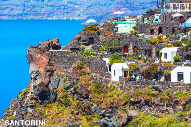 Santorini cliff side stone homes and swimming pool