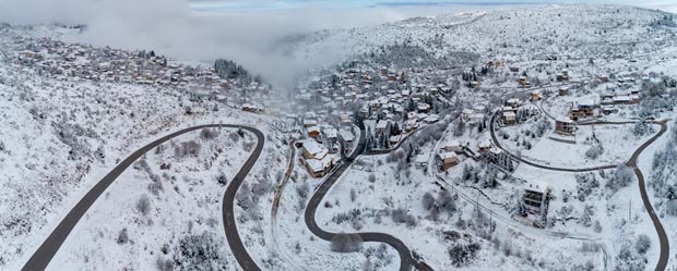 Snowy landscape village in Greece
