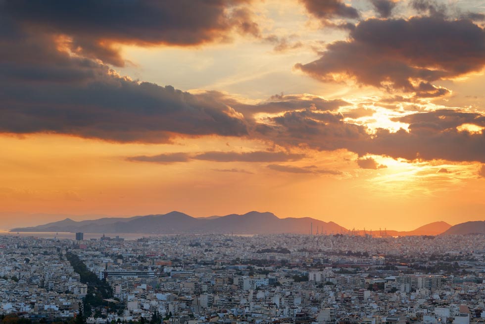 Sunset colors over Athens with Piraeus in far distance