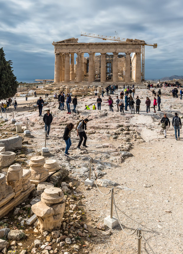 Tourists inspecting the the Acropolis in Athens Greece