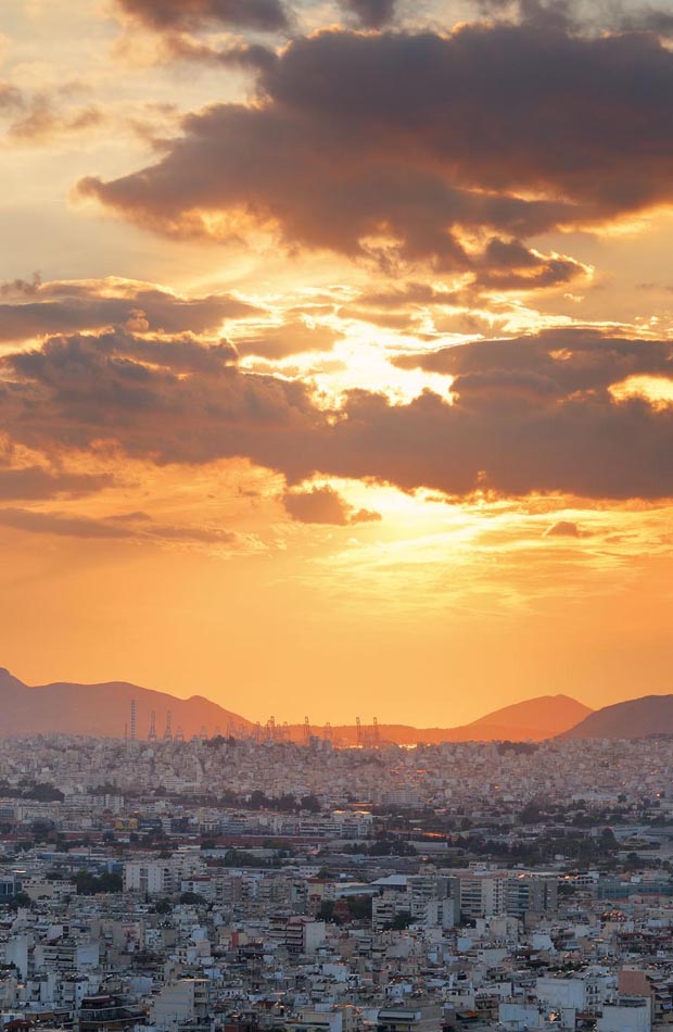 Sunset colors over Athens with Piraeus in far distance